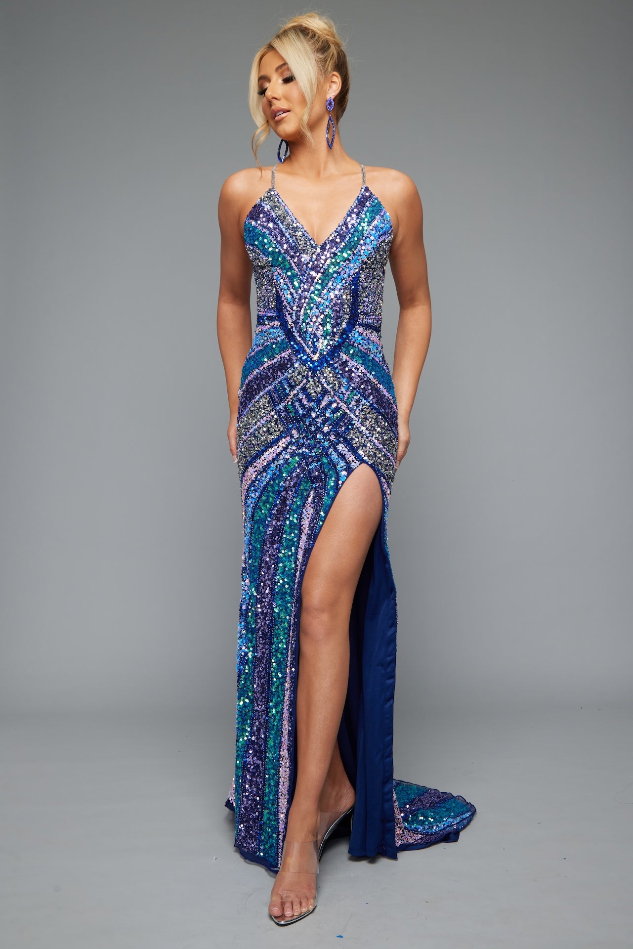 Front view of Jasz Couture Style 7665: a navy multicolored beaded prom dress with a high slit, strappy open back, and spaghetti straps.