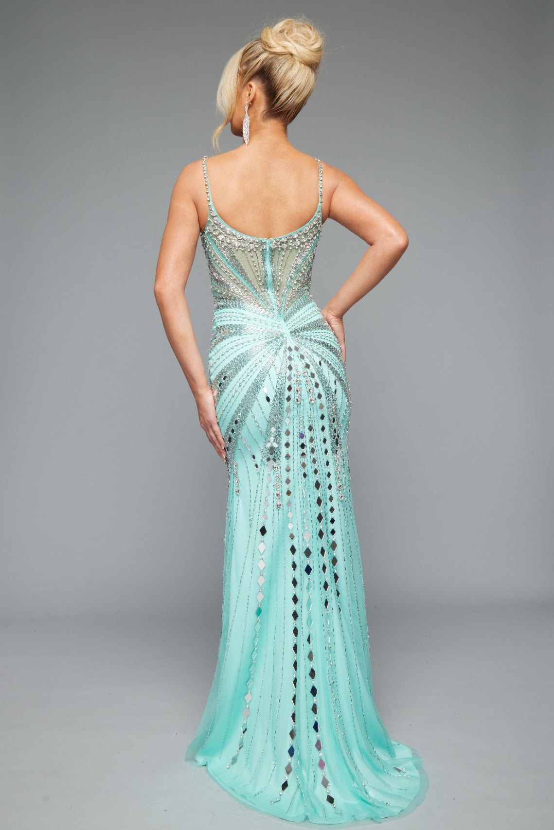 Back view of Style 7627: a refined prom dress featuring a beaded design, mirror accents, and spaghetti straps. Shown in mint and ideal for turning heads.