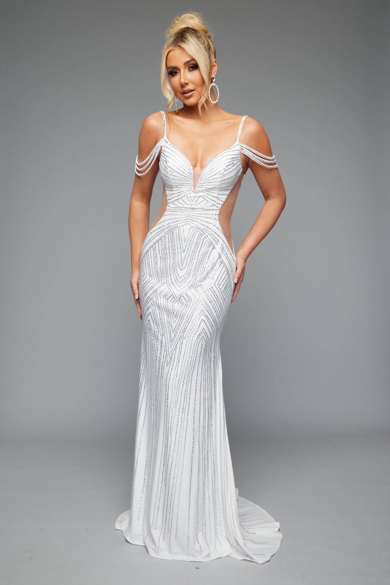Front view of Jasz Couture Style 7642: an enchanting off the shoulders white prom dress featuring a beaded design, cutouts, open back, and spaghetti straps.