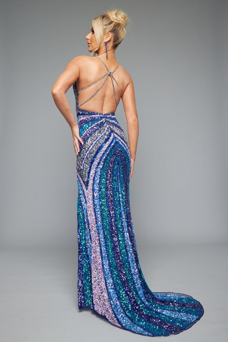 Back view of Jasz Couture Style 7665: a navy multicolored beaded prom dress with a high slit, strappy open back, and spaghetti straps.