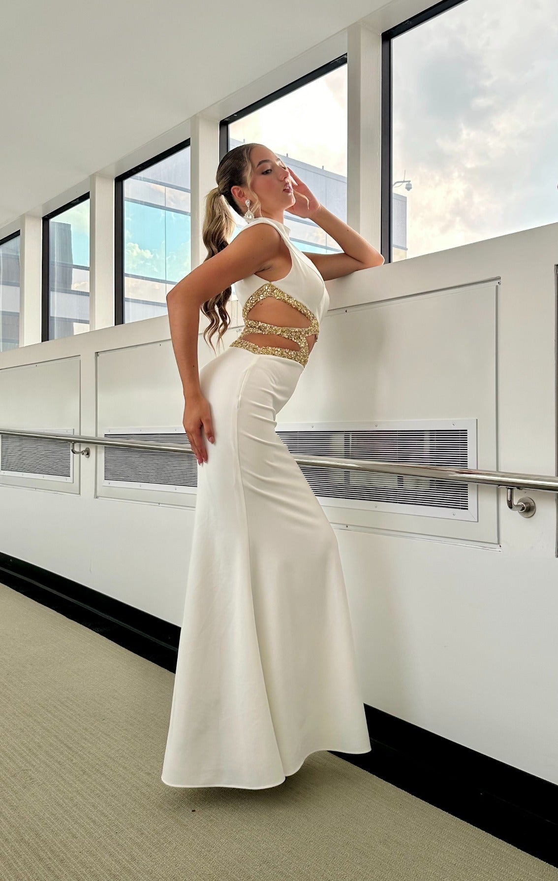 Style 7620 prom dress with beaded accents, cutouts, fitted, and a high neckline, shown in WHITE/GOLD, offering an elegant look.