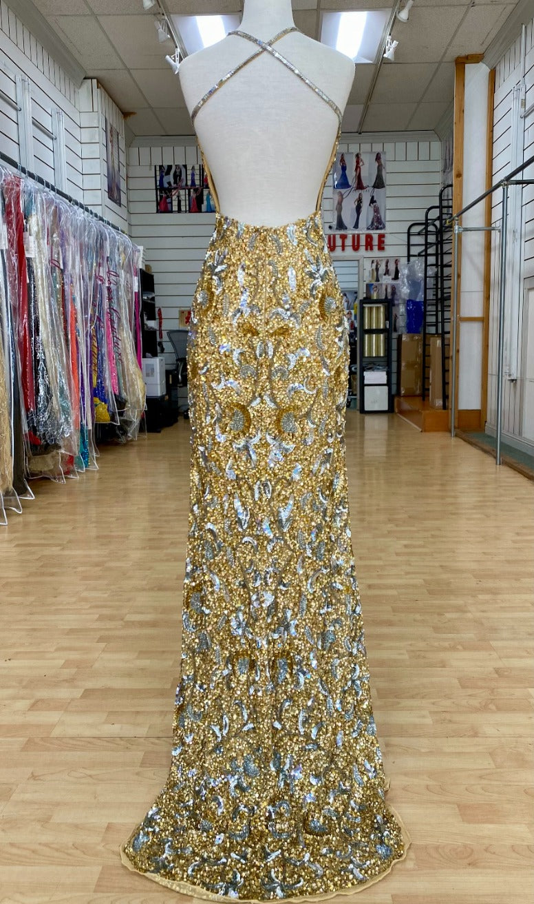 Back view of Jasz Couture Style 7643: an enchanting gold prom dress featuring a beaded design, open back, halter plunge neckline, and spaghetti straps.