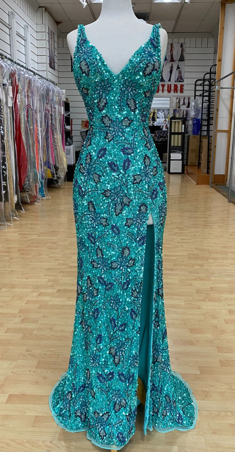 Front view of Style 7664: a jade patterned prom dress with beads, high slit, lace up back, and spaghetti straps.