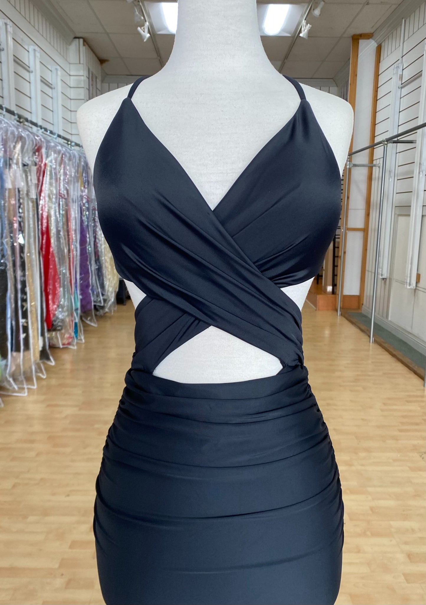 Front view of best selling Style 7683: a dazzling black prom dress featuring cutouts, halter, lace up back, and spaghetti straps.