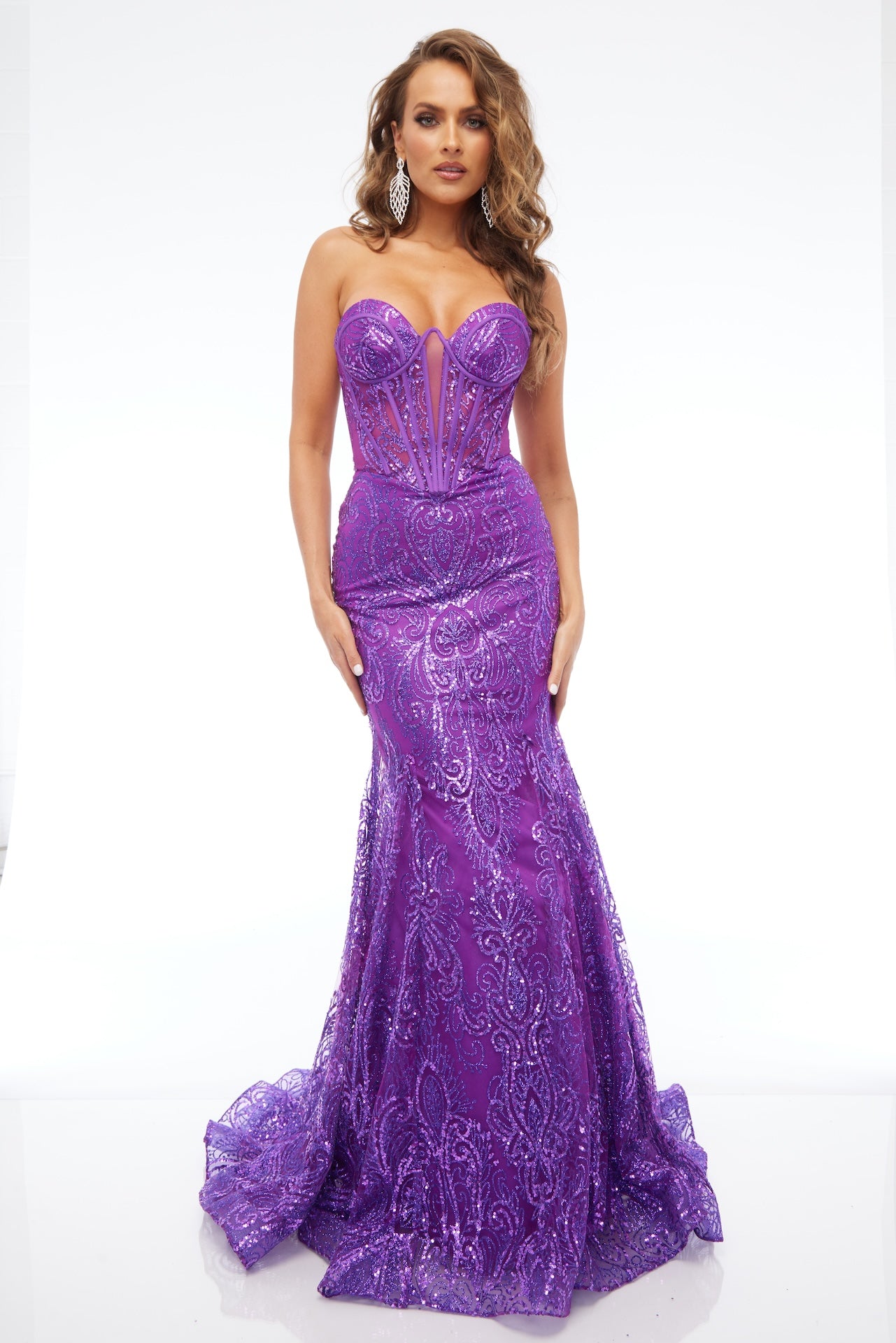 Front view of Style 7707: a bold strapless purple prom dress featuring a sweetheart neckline and a corset lace up back. 