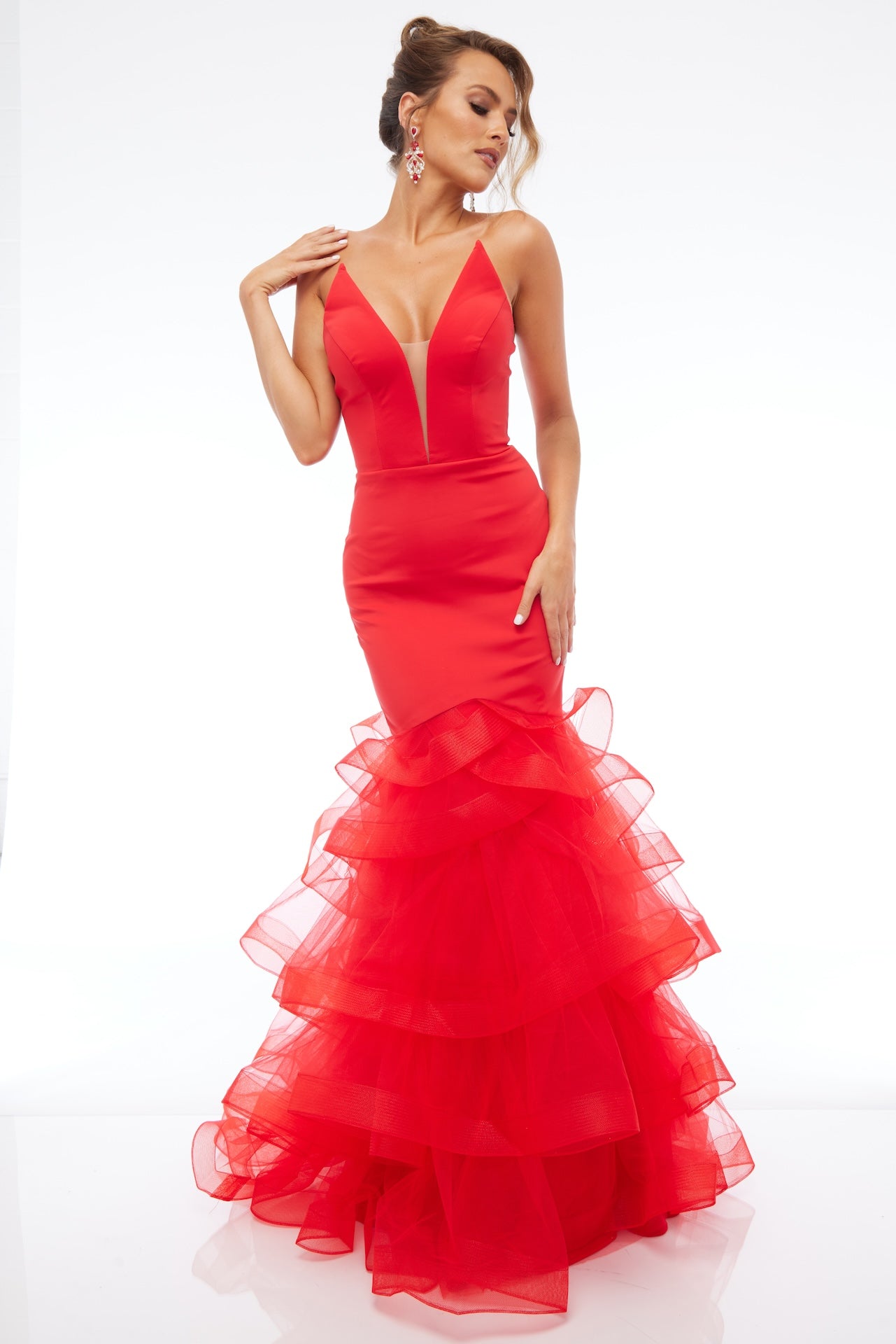 Front of Style 7670: a captivating fitted red prom dress with a strapless plunge neckline and tulle skirt. 