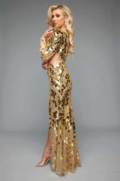 Side view of a glamorous fitted gold prom dress with one shoulder, long sleeve, and a high slit. Features reflective mirror accents throughout and a side cut-out for a bold, sophisticated look.