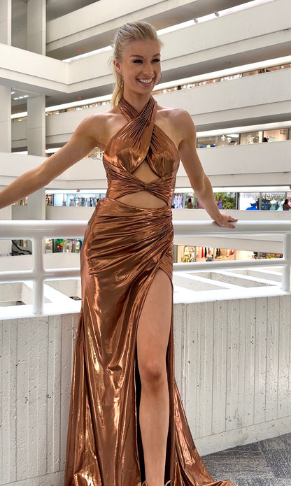 Front view of Jasz Couture metallic copper satin, fitted prom dress with a halter cross-over neckline, cutouts, and open back.