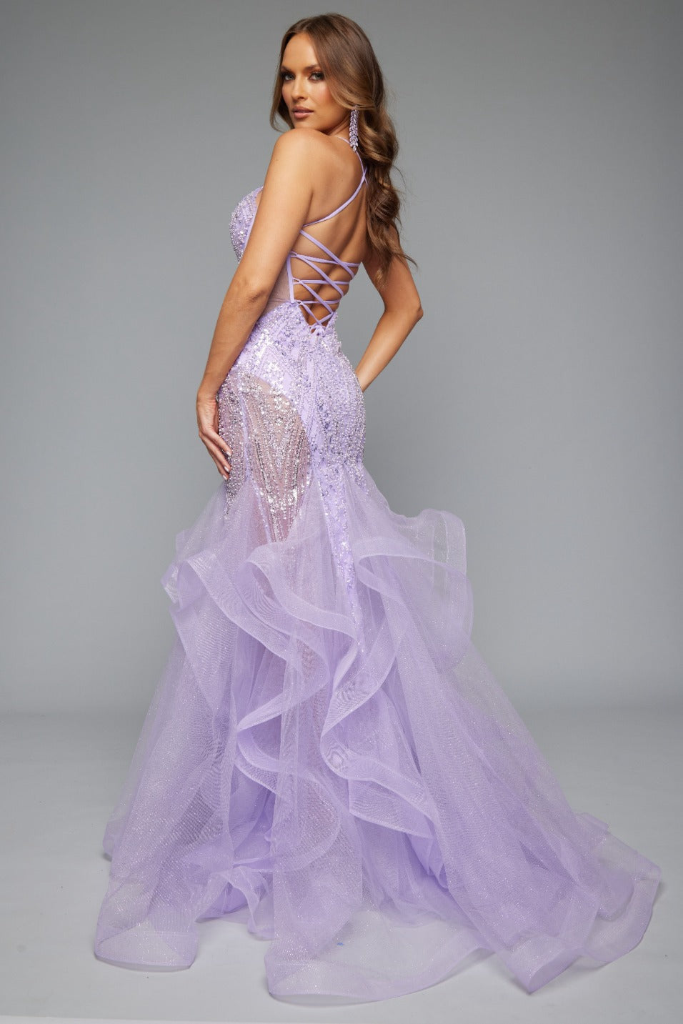 Back view of our glamorous lilac spaghetti strap prom dress with tulle skirt, lace up back, and corset detail. Bold, feminine, and perfect for prom 2025.