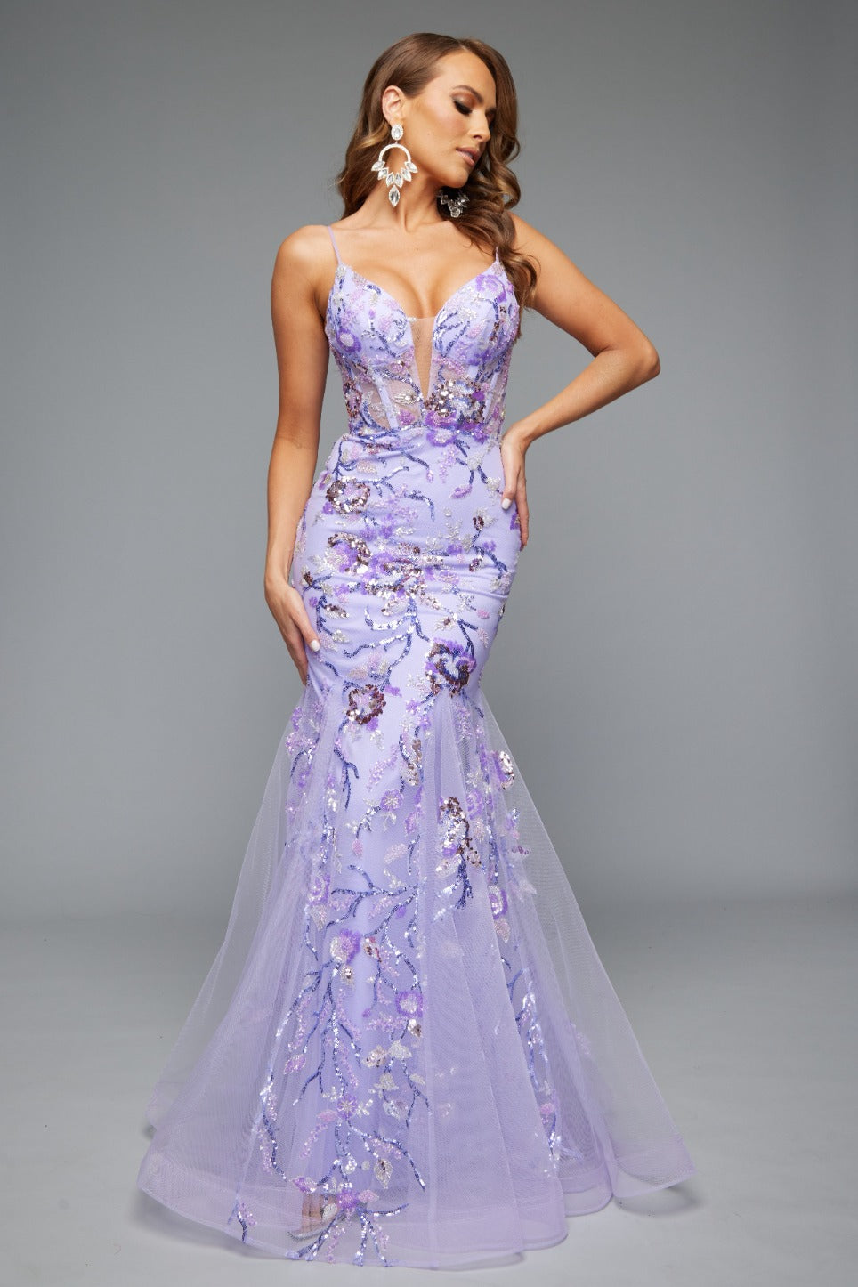 Front view of Jasz Couture Style 7619: a best-selling prom dress with a mermaid silhouette, tulle skirt, and applique details in lilac.