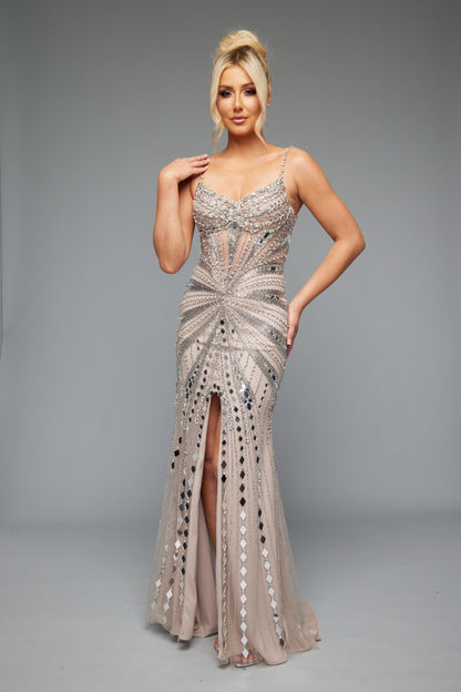 Front view of Style 7627: a refined prom dress featuring a beaded design, mirror accents, and spaghetti straps. Shown in nude and ideal for turning heads.