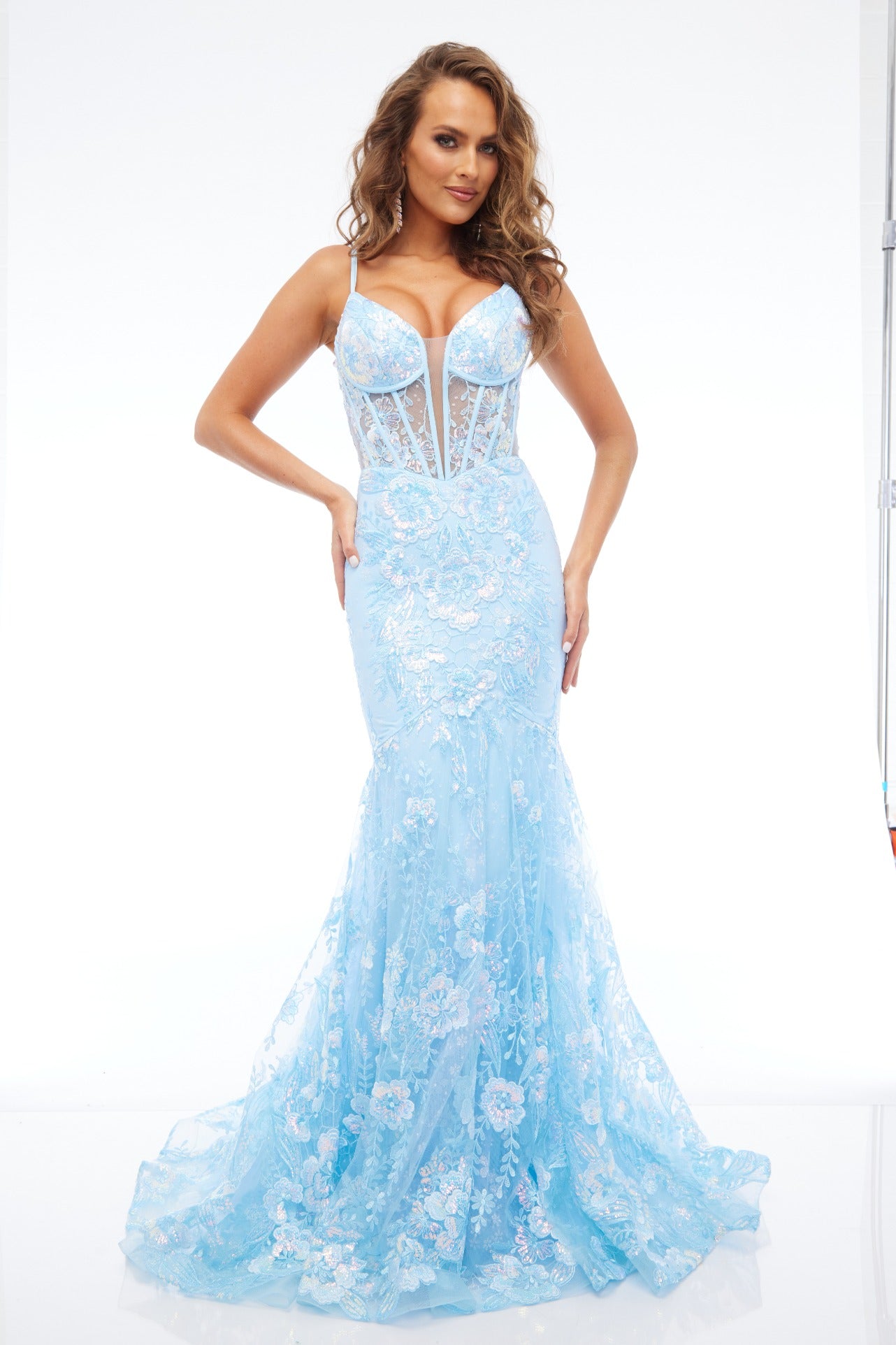 Front view of our best selling Style 7657: a feminine spaghetti strap prom dress with applique and corset lace up details shown in light blue.