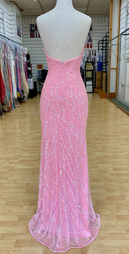 Back view of Jasz Couture Style 7666: a dazzling strapless pink prom dress featuring a beaded design, high slit, and a plunging sweetheart neckline.