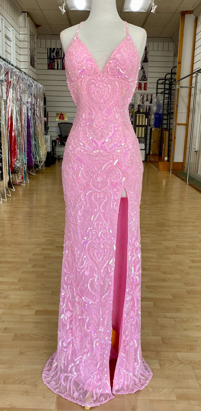 Front view of best selling Style 7692: an enchanting beaded pink prom dress with a halter, high slit, open back, and spaghetti straps.