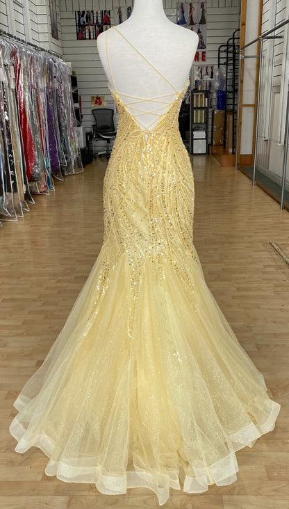 Back view of Style 7696: an enchanting fitted yellow prom dress featuring a beaded design, lace up back, one shoulder, and tulle skirt. 