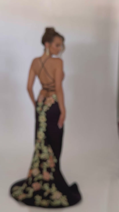 Video of Style 7680: an enchanting black prom dress featuring detailed floral applique, high slit, lace up back, plunge neckline, and spaghetti straps.