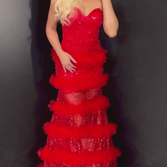 Stunning red sleeveless prom dress with a sweetheart neckline, sheer tulle skirt, and sequin accents. 