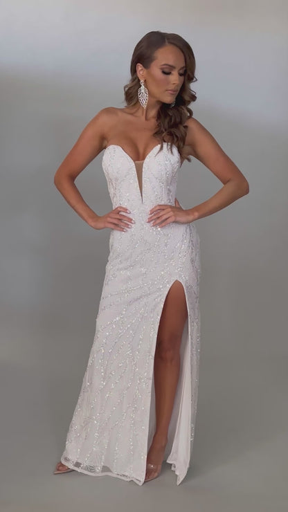 Video of Jasz Couture Style 7666: a dazzling strapless white prom dress featuring a beaded design, high slit, and a plunging sweetheart neckline.