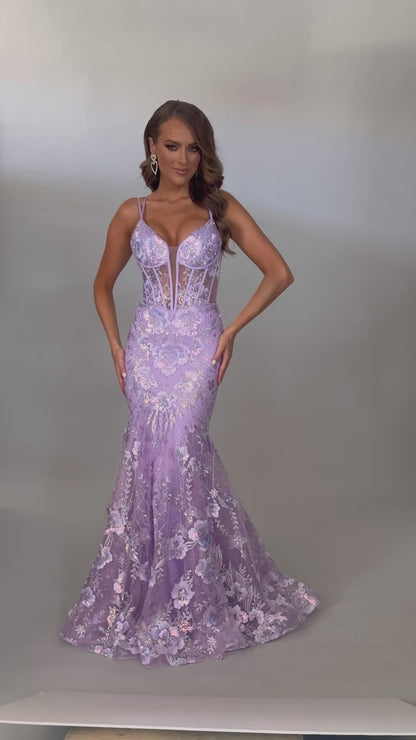 Video of our best selling Style 7657: a feminine spaghetti strap prom dress with applique and corset lace up details. Available in light blue and lilac and designed to make a statement on prom night.