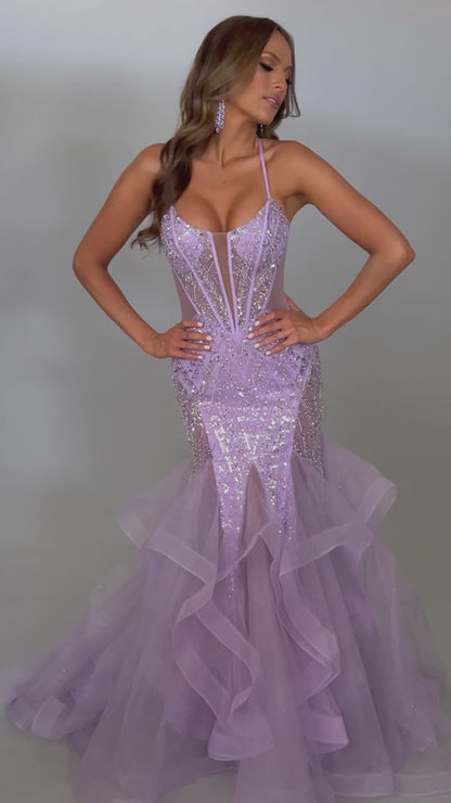 Video of our glamorous lilac spaghetti strap prom dress with tulle skirt, lace up back, and corset detail. Bold, feminine, and perfect for prom 2025.