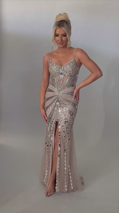 Video of Style 7627: a refined prom dress featuring a beaded design, mirror accents, and spaghetti straps. Shown in nude and ideal for turning heads.